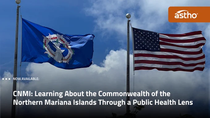 Two flags are waving on flagpoles against a cloudy sky. The flag on the left represents the Commonwealth of the Northern Mariana Islands, featuring a blue background with a symbol in the center. The flag on the right is the United States flag. An "astho" logo is in the top right corner. Text at the bottom reads: "CNMI: Learning About the Commonwealth of the Northern Mariana Islands Through a Public Health Lens.