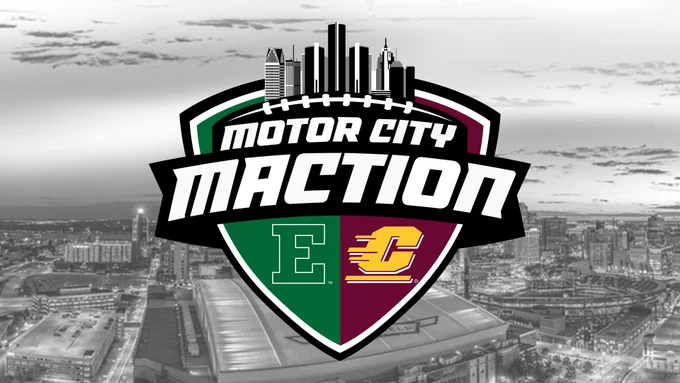 The image features a logo for the "Motor City MACtion" event. The logo includes the skyline of a city at the top, with the letters "E" on a green background and "C" on a maroon background. A grayscale cityscape is visible in the background.