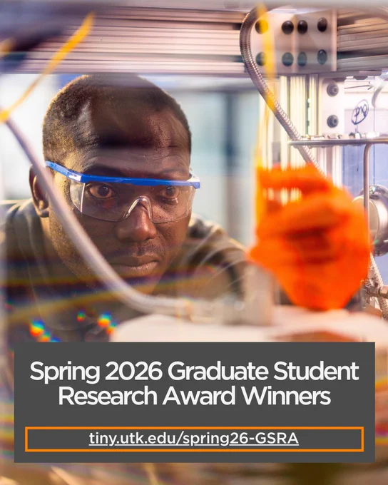A person wearing safety goggles is intently observing a 3D printer in action. Text at the bottom reads "Spring 2026 Graduate Student Research Award Winners" with a URL provided.