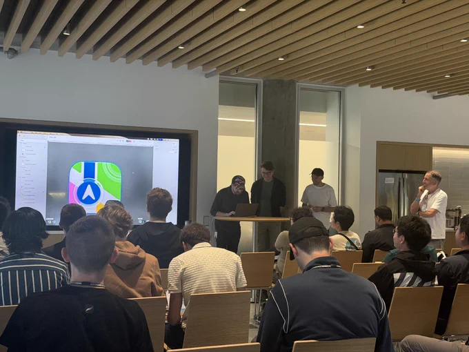 Photo from the Icon Composer lab showing the Apple Maps icon on screen.