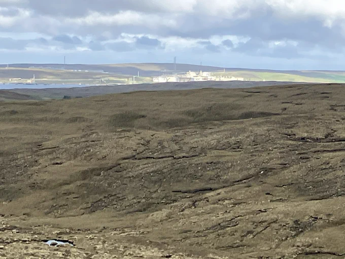 The Sullom Voe Oil Terminal from a distance, bathed in sunlight

No tankers docked there or anywhere else near Shetland, because of the closure of the Straight of Hormuz