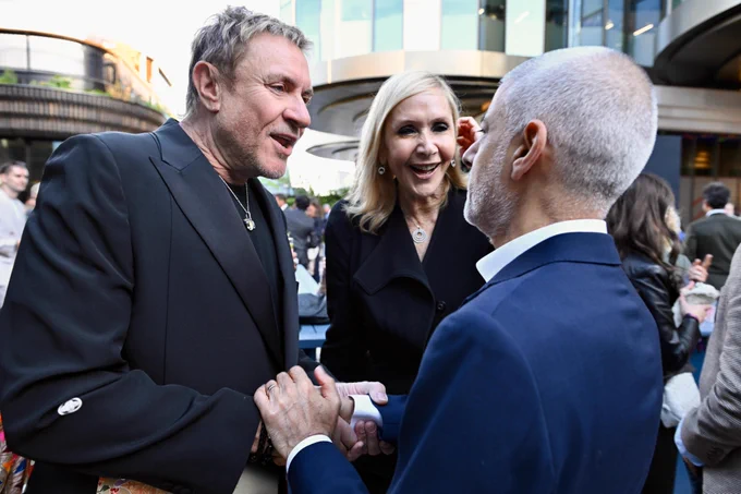 Mayor of London shaking hands with Simon Le Bon 
