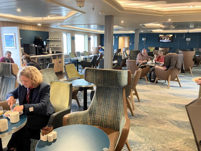 Passengers eating breakfast in the Magnus Lounge