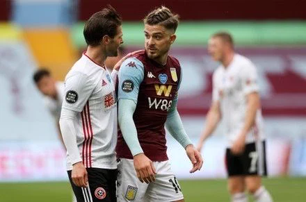 Ollie Norwood of Sheffield United and Jack Grealish of Aston Villa