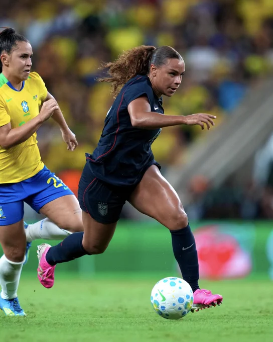 Action shot of Cooper on the ball for the USWNT