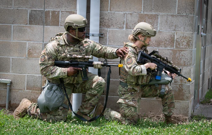 138th Security Forces Airmen prepare to engage Oppositional Force during a Combat Readiness Exercise at Camp Gruber, Okla., June 5, 2026. During the exercise, the 138th FW simulated a hostile environment to equip Airmen with the skills necessary to perform their duties in a deployed setting. (Oklahoma Air National Guard photo by Senior Airman Christian Corley)