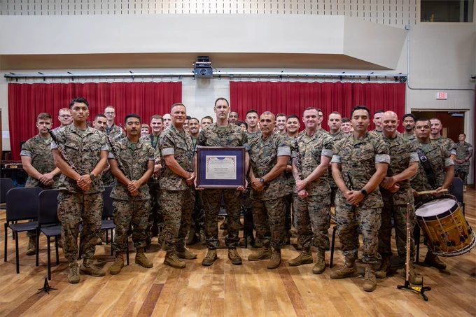 Marines with the Marine Forces Reserve Band pose with the Colonel George S. Howard Citation of Musical Excellence.
