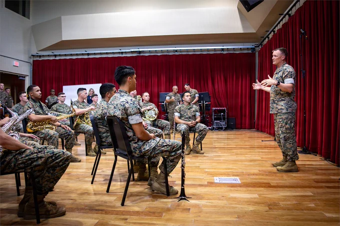 A senior Marine addresses members of the Marine Forces Reserve Band during a ceremony recognizing musical excellence.