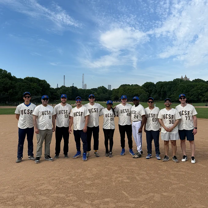 The UCSF Neurosurgery residents and faculty who participated in the tournament stand together for a team photo on the field. 