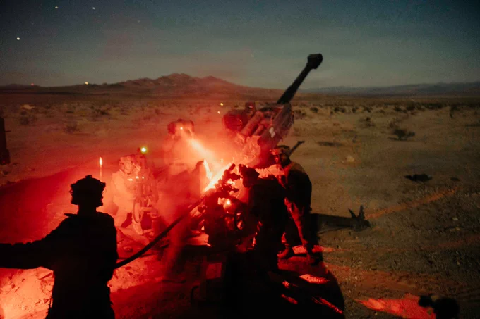 U.S. Marines assigned to Battalion Landing Team 2/4, 13th Marine Expeditionary Unit, load a projectile in an M777 howitzer during unit-level training at Marine Corps Air Ground Combat Center Twentynine Palms, California, May 30, 2026. Unit-level training allows the artillery battery to hone fundamental skills and fire-direction procedures, forging a lethal and cohesive team prepared to provide critical fire support for the 13th MEU during complex and austere operations. (U.S. Marine Corps photo by Sgt. Mary R. Jenni)

