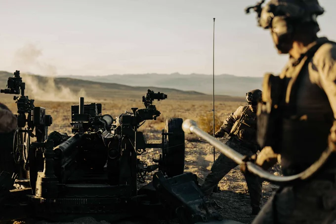U.S. Marines assigned to Battalion Landing Team 2/4, 13th Marine Expeditionary Unit, fire an M777 howitzer in support of a fire mission during unit-level training at Marine Corps Air Ground Combat Center Twentynine Palms, California, May 31, 2026. Unit-level training allows the artillery battery to hone fundamental skills and fire-direction procedures, forging a lethal and cohesive team prepared to provide critical fire support for the 13th MEU during complex and austere operations. (U.S. Marine Corps photo by Sgt. Mary R. Jenni)

