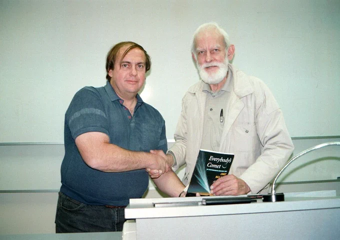 Over 200 people of all ages were present at Adelaide University on 24 June 1997 for a public lecture by Dr Alan Hale -- co-discoverer of Comet Hale-Bopp. After the entertaining talk, Dr Hale (left) presented a copy of his book "Everybody's Comet" to Bill Bradfield -- the 20th century's most prolific visual comet discoverer (18 comets).
Photo Credit: Kym Thalassoudis