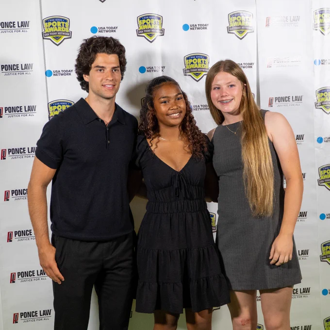 Photo of Luke Evangelista posing with fans at the Middle Tennessee High School Sports Awards