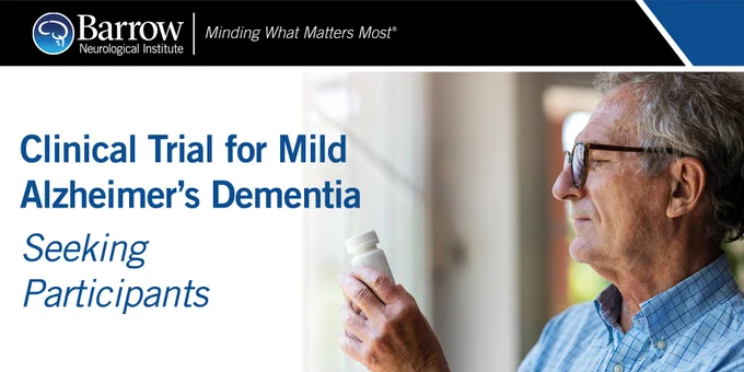 An older man looks at a bill bottle. Text: Clinical Trial for Mild Alzheimer's Dementia - Seeking Particiants