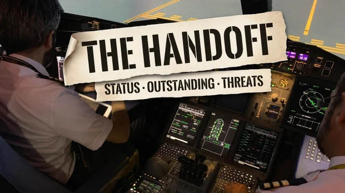 An A380 cockpit at dusk seen from behind, two pilots in white uniform shirts at the lit glass displays, the runway visible through the windscreen. Two torn-paper magazine-cutout ribbons in bold black stencil capitals overlay the photo: a large top ribbon reading 'THE HANDOFF' and a lower ribbon reading 'STATUS · OUTSTANDING · THREATS.'