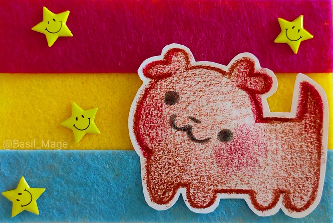 Pansexual pride flag made out of felt with a cutout drawing of a puppy 