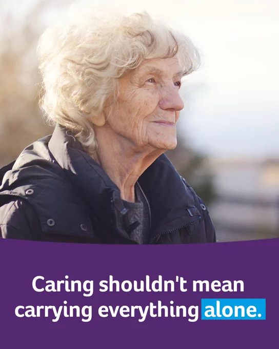 An older adult with light hair looks thoughtfully into the distance. They are wearing a dark jacket. Below them, a message reads, "Caring shouldn't mean carrying everything alone."
