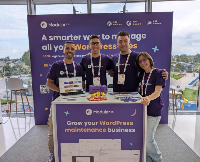 Modular DS team members standing together at the Modular DS booth at WordCamp Europe 2026.