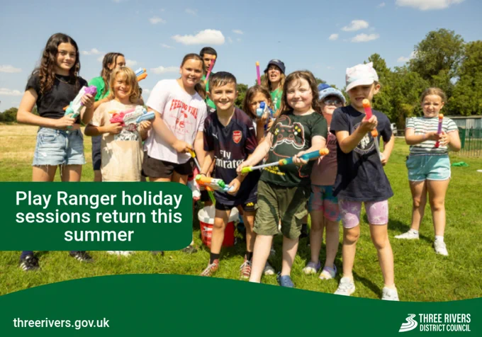Children holding water pistols outdoors, smiling. Title reads: 'Play Ranger holiday sessions return this summer'