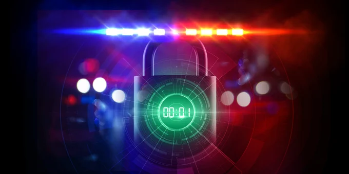 A digital padlock with a countdown timer is illuminated by flashing police lights, suggesting urgency and the need for protection.
