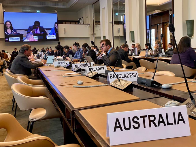 Photo of the meeting room from behind the Australia country nameplate.