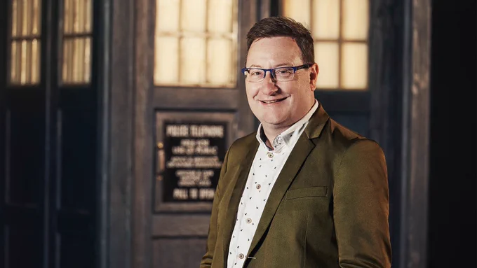 Chris Chibnall in front of the TARDIS