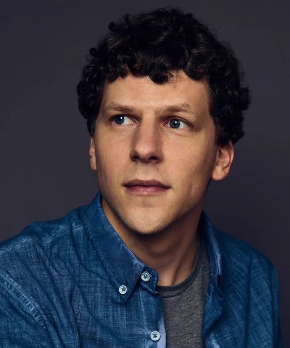 Jesse Eisenberg headshot, he's wearing a blue shirt