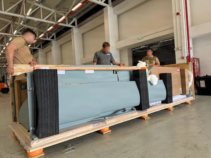 Members of a DZYNE Technologies team assemble a Long Range Grasshopper system, or LRGH, ahead of a demonstration during Trojan Footprint 2026 in Bucharest, Romania, May 14, 2026. Trojan Footprint is a key biennial training event, focused on posturing Allies to deter aggression and defend regional security through joint and multinational cooperation. The Grasshopper system is an aerial platform designed to expand long-range, low-cost, precision sustainment in contested environments. (U.S. Army National Guard photo by Staff Sgt. Melyssa Vazquez)