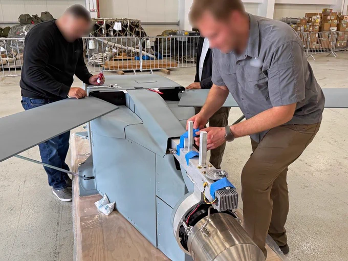 Members of a DZYNE Technologies team assemble a Long Range Grasshopper system, or LRGH, ahead of a demonstration during Trojan Footprint 2026 in Bucharest, Romania, May 14, 2026. Trojan Footprint is a key biennial training event, focused on posturing Allies to deter aggression and defend regional security through joint and multinational cooperation. The Grasshopper system is an aerial platform designed to expand long-range, low-cost, precision sustainment in contested environments. (U.S. Army National Guard photo by Staff Sgt. Melyssa Vazquez)
