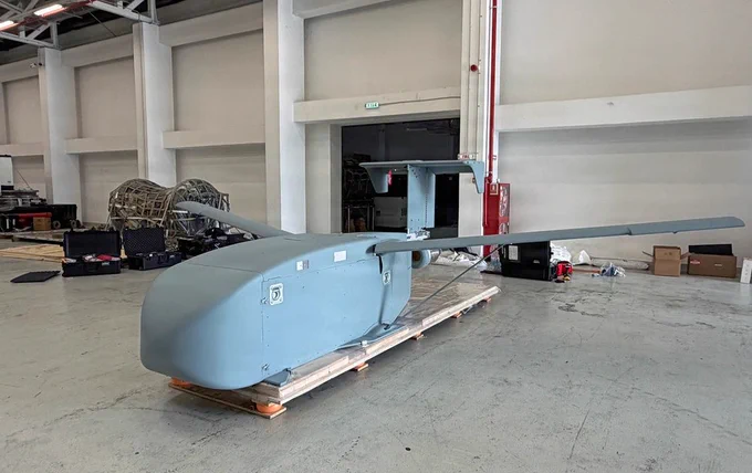 A fully assembled Long Range Grasshopper system, or LRGH, sits staged before a demonstration during Trojan Footprint 2026 in Bucharest, Romania, May 14, 2026. Trojan Footprint is a key biennial training event, focused on posturing Allies to deter aggression and defend regional security through joint and multinational cooperation. The Grasshopper system is an aerial platform designed to expand long-range, low-cost, precision sustainment in contested environments. (U.S. Army National Guard photo by Staff Sgt. Melyssa Vazquez)