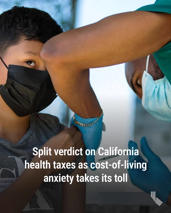 Derek Canizalez, 10, is administered a COVID-19 vaccine at one of St. John’s Well Child and Family Center mobile health clinics outside of Helen Keller Elementary School in Los Angeles on March 16, 2022. Photo by Alisha Jucevic for CalMatters