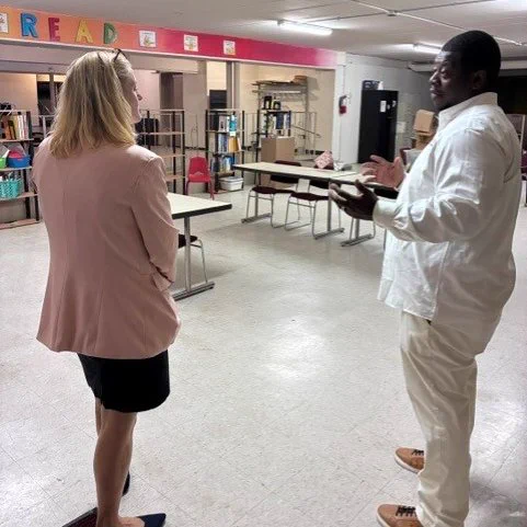 Pastor Marcus Allen and Secretary Godlewski talking.