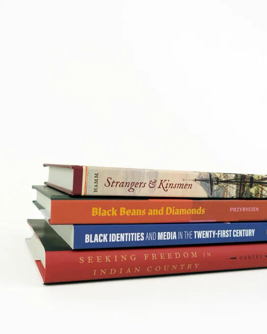 A stack of four books against a white background.

"Black Beans and Diamonds: Brazil in the Work of Elizabeth Bishop," translated by Neil K. Besner
"Strangers and Kinsmen: Portuguese Immigrants and the Spanish Caribbean, 1492–1650," by Brian Hamm
"Seeking Freedom in Indian Country: Slavery, Sovereignty, and Resistance within the Five Tribes, 1790–1861," by Kristen Tegtmeier Oertel
"Black Identities and Media in the Twenty-First Century," edited by Sheryl Kennedy Haydel and David Stamps