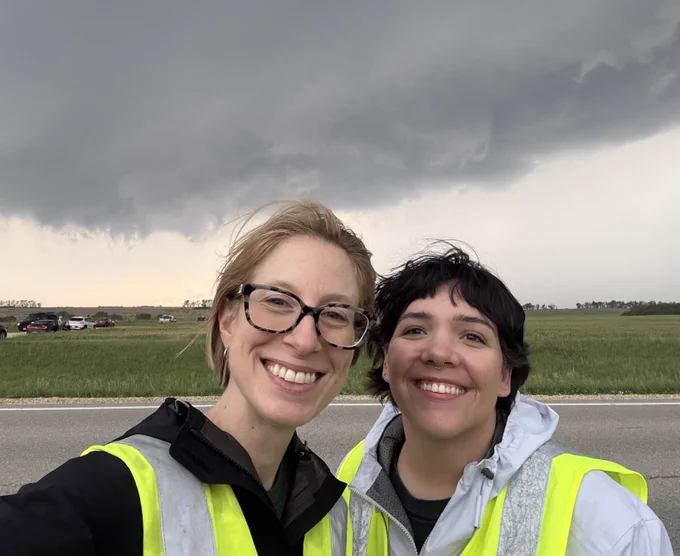 Walton (left) and Tomanek (right) in front of a wall cloud [Photo credit: FARM Facility]