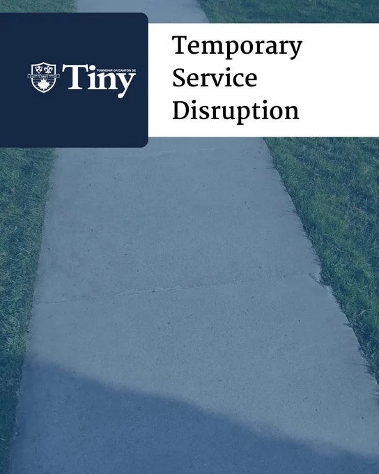 Concrete sidewalk bordered by grass with a notice of temporary service disruption from Township of Tiny.