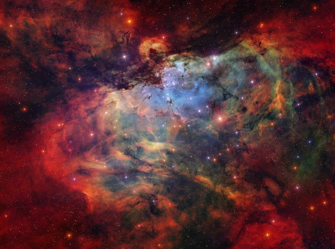 What looks as if it is going to swallow the great Pillars of Creation? The Eagle Nebula (M16) is not a bird, a plane, or Superman. M16 is actually a combination of several celestial objects. NGC 6611 is the young star cluster that appears to peak out beneath the Eagle’s “wings”. The ultraviolet light from these stars ionizes the surrounding gas, creating the emission nebula IC 4703. The Stellar Spire is seen reaching towards the Pillars of Creation from the left. Both are structures of cold gas and dust that are optimal for star formation. Some astronomers previously thought the Pillars of Creation had been evaporated away by a supernova. Because M16 is 6,000 light years away, we would not be able to see the Pillars’ destruction for thousands more years. However, there is no conclusive evidence of the theorized supernova, so the Pillars of Creation will likely continue to create stars for millions of years.