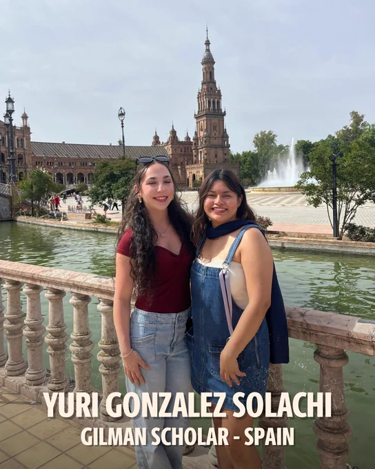 Photo of Yuri Gonzalez Solachi posed with a friend in front of castle architecture. Text on photo: Yuri Gonzalez Solachi. Gilman Scholar. Spain. 