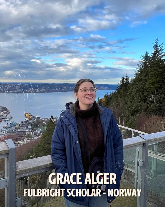 Photo of Grace Alger standing on a balcony with mountains and a body of water in the background. Text on photo: Grace Alger. Fulbright Scholar. Norway. 