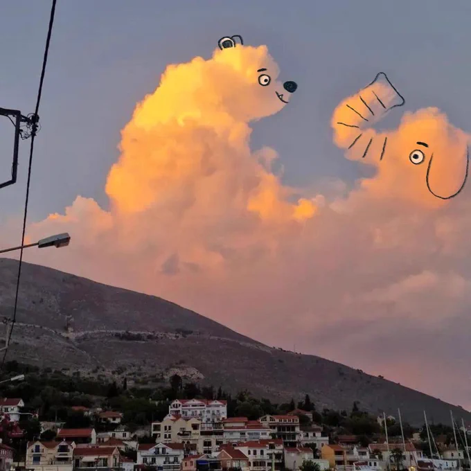 A photograph of a cloud with an overlaid drawing of a polar bear and an elephant. By Chris Judge.