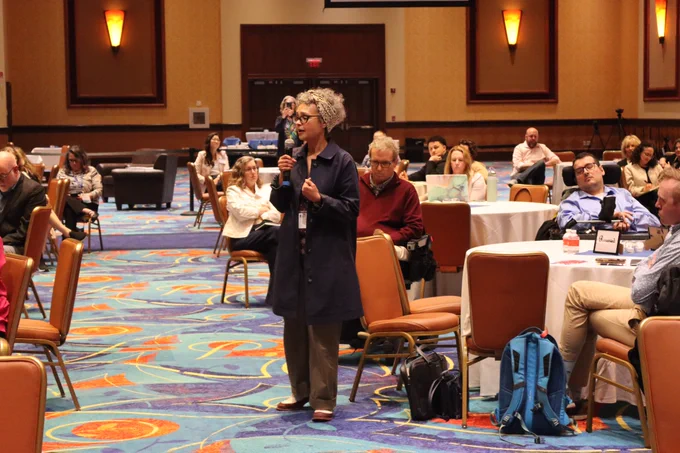 Rhode Island Representative Jennifer Stewart​ delivers a comment at the town hall.