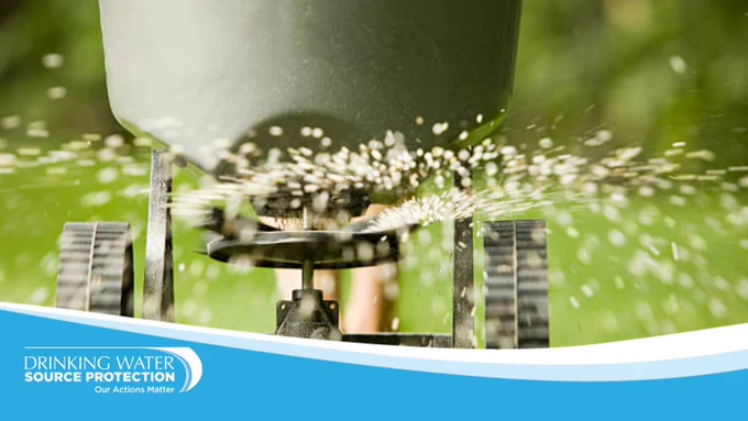 Fertilizer being spread on grass.