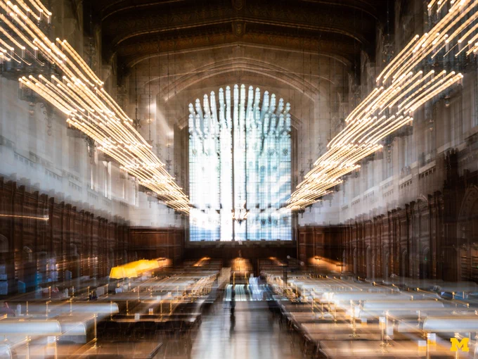 A motion blue photo of the Michigan Law Library.