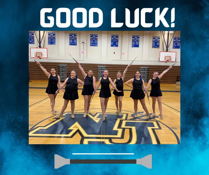 The graphic has the words Good Luck! at the top. In the middle is a picture of 7 girls in black dresses with batons are posed with hands alternating up and down with batons in a gym with “NJ” on the floor in front of them. They are the North Jefferson Middle School majorettes. Below the picture of a graphic of a baton.