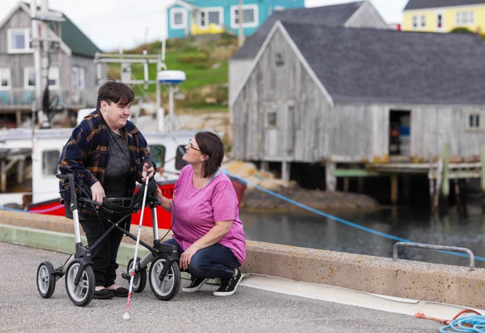 A person speaking to a person with a disability
