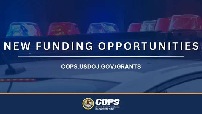 Police car lights flashing above text announcing new funding opportunities from the U.S. Department of Justice.
