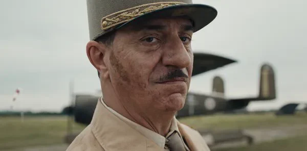 The character of de Gaulle looks to camera in De Gaulle: Resistance