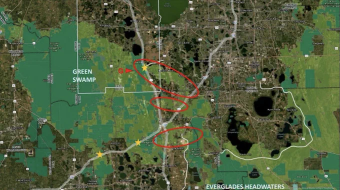 A detailed map illustrating the Green Swamp and Everglades Headwaters regions with marked routes and geographic areas. The map features green overlays indicating swamp areas and red circles and lines indicating specific locations.