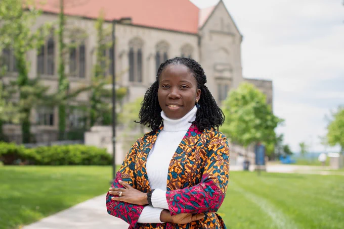 Patience Ocloo stands in front of KU's Watson Library