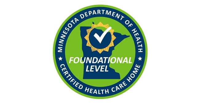 Green circle logo,  a graphic of the state of Minnesota, a yellow sun, and a white checkmark. Text reads, "Minnesota Department of Health. Foundational Level. Certified Health Care Home."