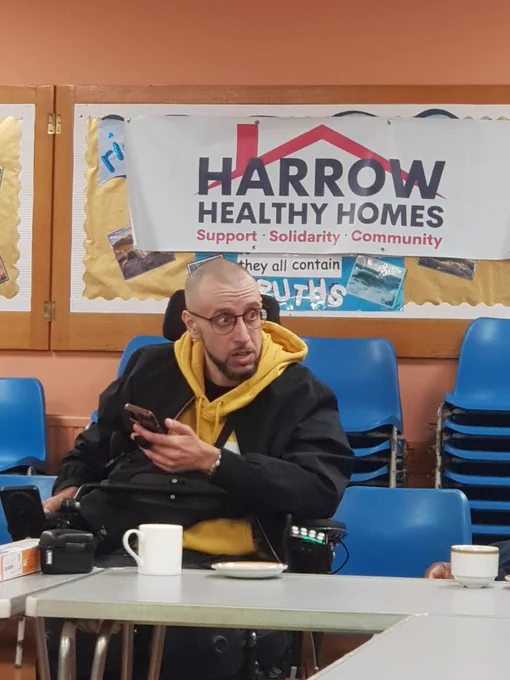 Disability rights campaigner Adam Gabsi delivers a speech at the Harrow Healthy Homes Assembly 2026